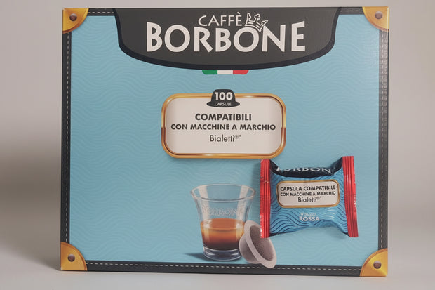A box of Borbone Bialetti Rossa 100 coffee capsules by Capsule Caffè & Dolci, showing the red packaging with coffee capsules inside.